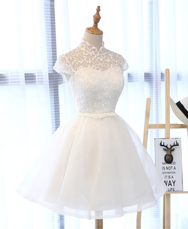 White lace dress on a mannequin against a white background
