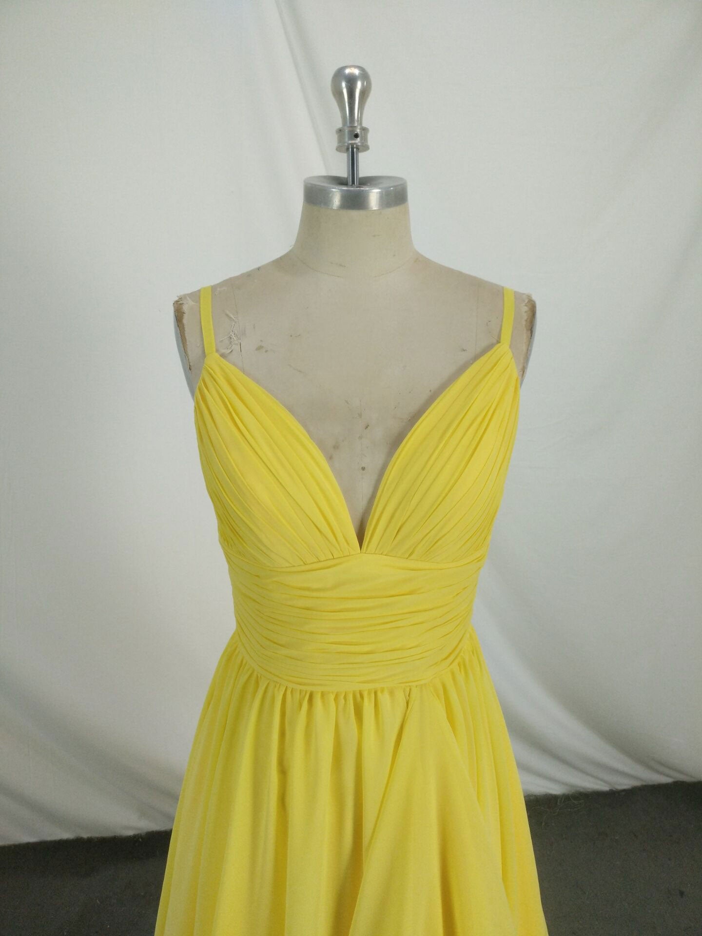 A-Line Spaghetti Straps V-Neck Floor-Length Yellow Chiffon Prom Dress with Ruched Bodice and Flowing Overlay